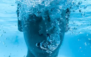 Image of man breathing under water