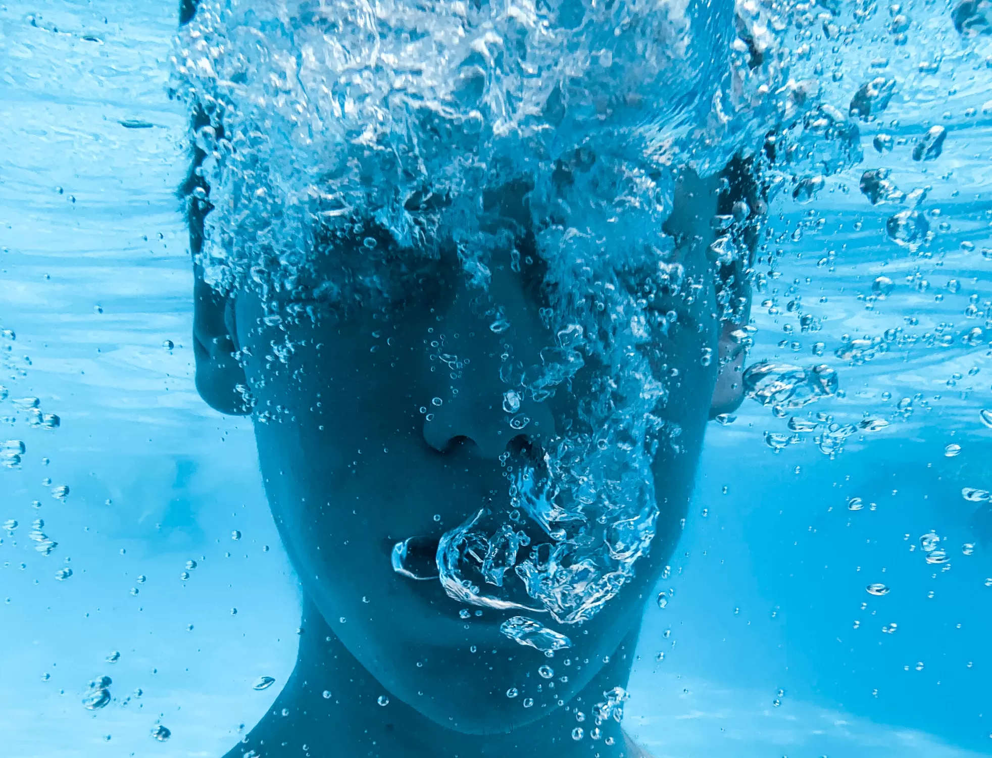 Image of man breathing under water